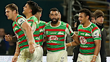 Alex Johnston celebrates one of his three tries against the Bulldogs with his Rabbitohs teammates
