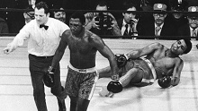 Joe Frazier is directed to his corner by referee Arthur Marcante after knocking down Muhammad Ali during the 15th round of their title fight at Madison Square Garden in New York.