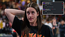 Caitlin Clark reacts on the sidelines.