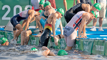 A false start forces triathletes out of the water