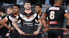 John Bateman of the Tigers reacts after a Sharks try.