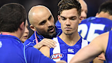 Shaw encourages Kangaroos youngster Jy Simpkin during a break