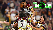 Brisbane Broncos players celebrate a try against the Cowboys.