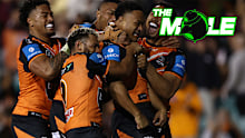 Wests Tigers players celebrate after scoring a try against Manly in 2024.