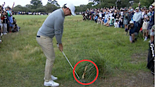 Rory McIlroy takes a shot.