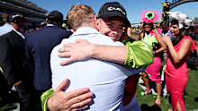 Melbourne Cup-winning jockey Robbie Dolan celebrates with Irish singer Ronan Keating.