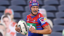 Knights fullback Kalyn Ponga on his way to the tryline against Canberra.