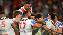 Dragons players celebrate a Jaydn Su'A try during their round 19 NRL match against the Brisbane Broncos.