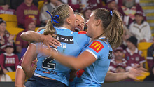 Jamie Chapman and teammates celebrate her try in the first half of the opening women's State of Origin match.