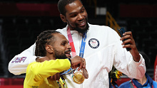 Kevin Durant and Patty Mills after the Olympic medal ceremony.
