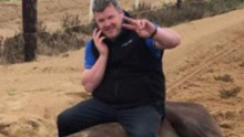 Trainer Gordon Elliott sits atop a dead horse in a viral image.