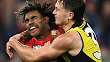 Melbourne's Kysaiah Pickett and Richmond's Rhyan Mansell clash at the MCG.
