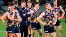 The fans left early as the Crows were outscored nine goals to one in the second half by their bitter rivals