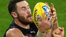 Carlton forward Mitch McGovern takes a mark against Richmond in round one of the AFL.
