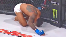 Bellator Kickboxing champion Raymond Daniels lands low blow on Peter Stanonik.