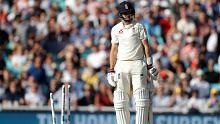 Joe Root looks at the wicket after being skittled by Pat Cummins