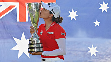 Major winner Minjee Lee of Australia poses for a photo with her trophy and the Aussie flag.