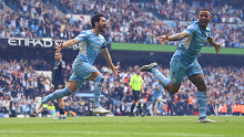 Ilkay Guendogan of Manchester City celebrates after scoring the team's third goal against Aston Villa.