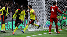 Watford's Ismailia Sarr (2L) celebrates one of his goals in an EPL win over Liverpool.