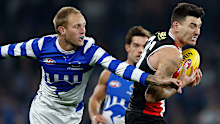 Jaidyn Stephenson of the Kangaroos competes with Josh Battle of the Saints.