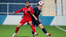 Bahrain's Ali Madan (L) fights for the ball with Australia's Jordan Jacob Bos in the international friendly on January 6, 2024 in Abu Dhabi, United Arab Emirates. (Photo by Martin Dokoupil/Getty Images)