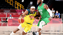 Patty Mills of Australia takes on the defence of Josh Okogie of Nigeria during the preliminary rounds of the Men's Basketball match between Australia and Nigeria on day two of the Tokyo 2020 Olympic Games at Saitama Super Arena on July 25, 2021 in Saitama, Japan. (Photo by Bradley Kanaris/Getty Images)