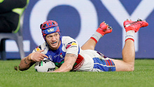 Kalyn Ponga of the Knights scores a try during the round 10 NRL match between the South Sydney Rabbitohs and the Newcastle Knights at Bankwest Stadium.