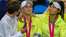 Ashleigh Barty is consoled by her team after Australia's defeat in the Fed Cup final.