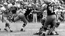 New Orleans Saints kicker Tom Dempsey (19) moves in to hit his iconic 63-yard field goal in 1970.