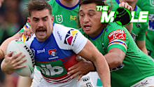 Knights utility Connor Watson is tackled by Raiders prop Josh Papali'i.