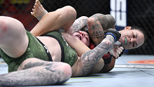 Amanda Nunes secures an arm bar submission against Megan Anderson of Australia in their featherweight championship fight at UFC 259.