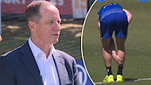 Don Pyke and Harley Reid clutches at his calf.