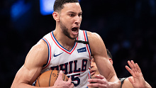 Philadelphia 76ers guard Ben Simmons reacts after grabbing a rebound during the second half of an NBA game against the Brooklyn Nets