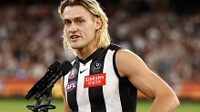 Collingwood skipper Darcy Moore addresses the crowd after his side's Anzac Day win over Essendon.