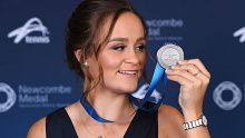 Ashleigh Barty poses with her medal after being awarded the 2019 Newcombe Medal