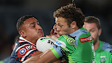 Roosters enforcer Sio Siua Taukeiaho crashes into Raiders centre Seb Kris.
