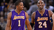Los Angeles Lakers' Darius Morris (1), Kobe Bryant (24) celebrate their win agains the Golden State Warriors at Oracle Arena in Oakland, Calif. on Saturday, Dec. 22, 2012. Los Angeles defeated Golden State 118-115 in overtime. (Jose Carlos Fajardo/Staff)