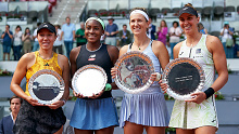 Cropped: Runners up Jessica Pegula (L) and Coco Gauff (2L) of United States and Winners Victoria Azarenka (2R) and Beatriz Haddad Maia (R) of Brazil pose while holding their trophy's after the Woman's Doubles Final match on Day Fourteen of the Mutua Madrid Open at La Caja Magica on May 07, 2023 in Madrid, Spain. (Photo by Jose Manuel Alvarez/Quality Sport Images/Getty Images)