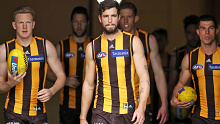 James Sicily, Ben Stratton and Jaeger O'Meara of the Hawks