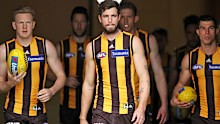 James Sicily, Ben Stratton and Jaeger O'Meara of the Hawks