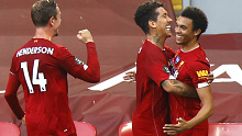 Liverpool's Trent Alexander-Arnold (R) celebrates after scoring a stunning free kick.