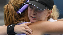 Francesca Jones embraces Nadia Podorska after a tune-up match ahead of the Australian Open.