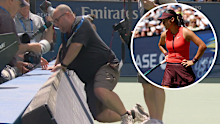A photographer's tumble holds up Emma Raducanu's first round match at the US Open.