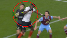 Burnley 'keeper James Trafford collides with Luton forward Elijah Adebayo. 