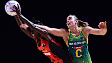Australian centre Liz Watson takes on Malawi's Takondwa Lwazi.
