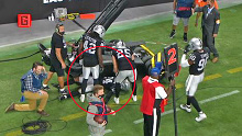 Raiders safety Abram collides with TV equipment on the sideline