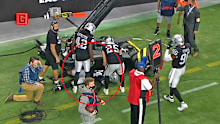 Raiders safety Abram collides with TV equipment on the sideline