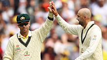 David Warner (left) and Nathan Lyon.