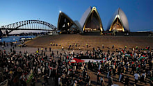 Palestine supporters rally outside the Sydney Opera House.