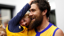 Josh Kennedy of the Eagles celebrates with daughter Lottie